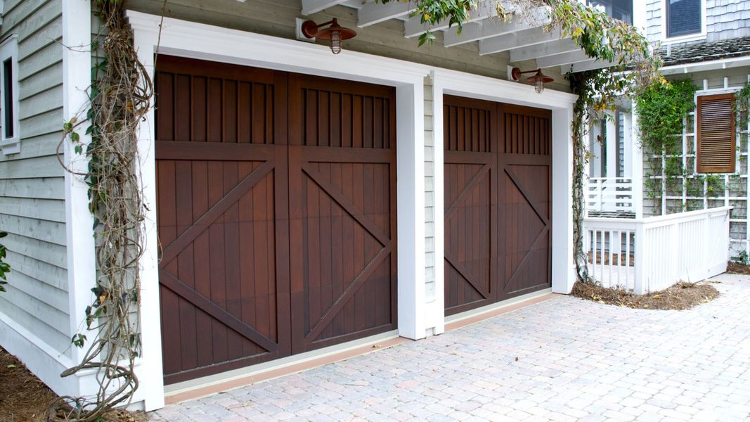 A door leading to a wooden door with a wooden frame. showcasing features like garage door services garage door repair garage door installation garage door spring repair new garage doors.