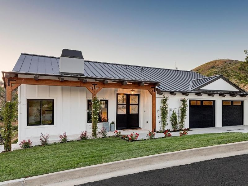 This scene from Lakewood, CO shows a house with a large window and a large building. with features such as garage door services garage door repair garage door installation garage door spring repair.