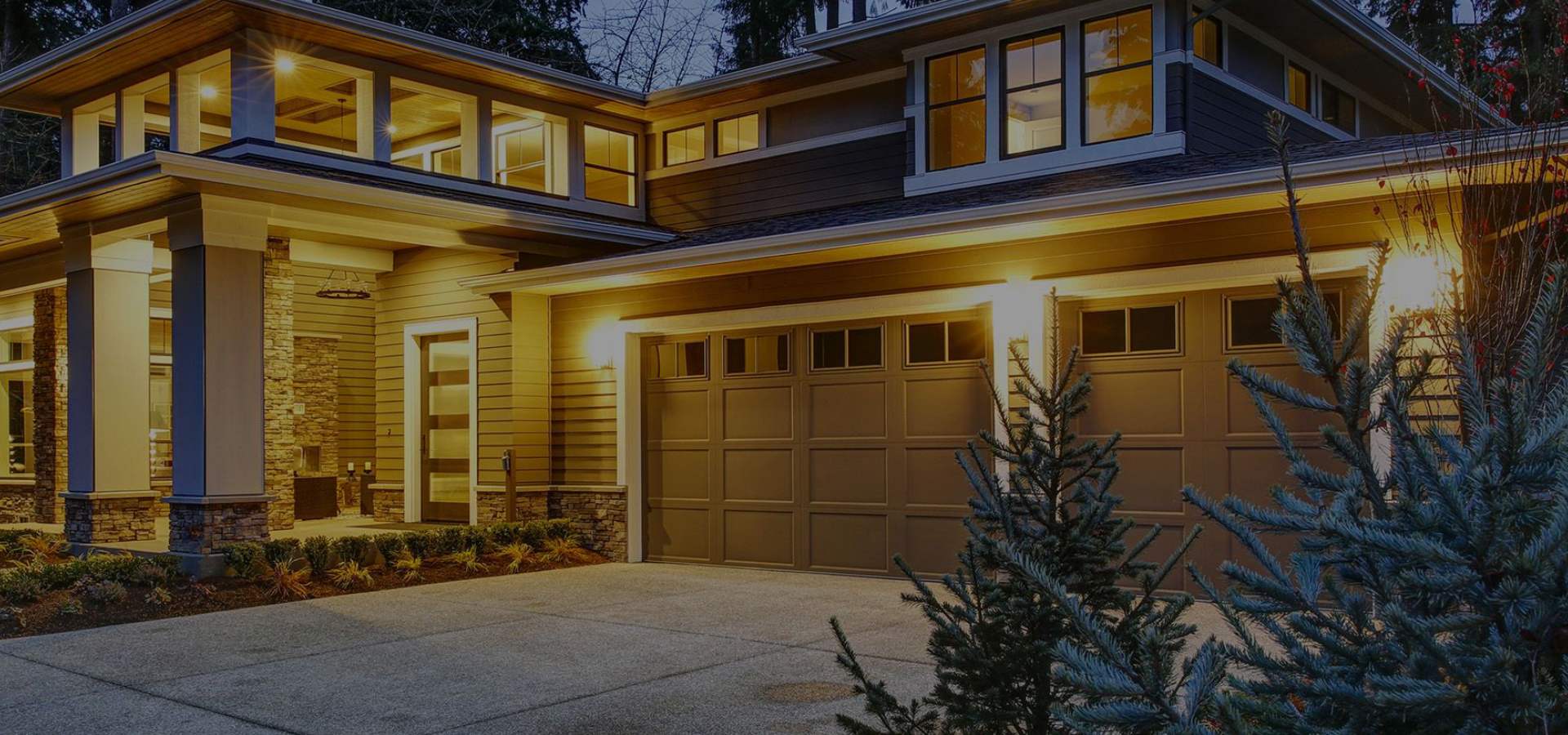 a house with a large window and a large tree. features garage door services garage door repair garage door installation garage door spring repair provided by Retrak Door Service.