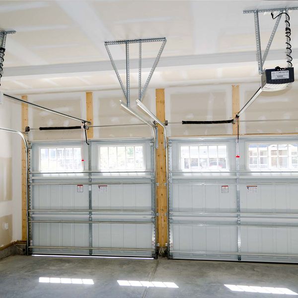 A room with a lot of windows and a ceiling. showcasing features like garage door services garage door repair garage door installation garage door spring repair.