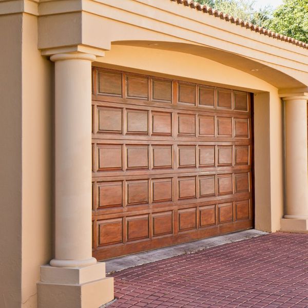 a brick building with a large window. features garage door services garage door repair garage door installation provided by Retrak Door Service.