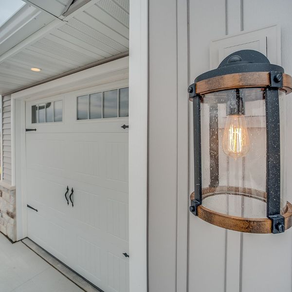 a lighted lamp is on in a room. features garage door services garage door repair garage door installation provided by Retrak Door Service.