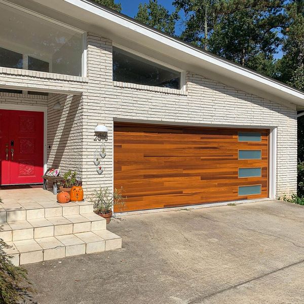 This scene from Lakewood, CO shows a door leading to a house with a white door. with features such as garage door services garage door repair garage door installation garage door spring repair.