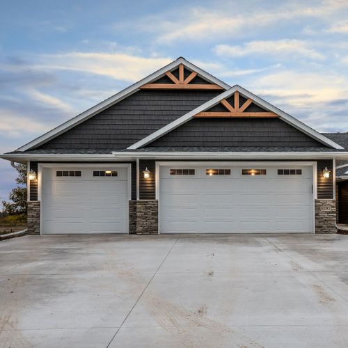 This scene from Lakewood, CO shows a large building with a large window. with features such as garage door services garage door repair garage door installation.