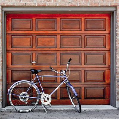 A bicycle parked next to a door with a window. showcasing features like garage door services garage door repair garage door installation garage door spring repair.