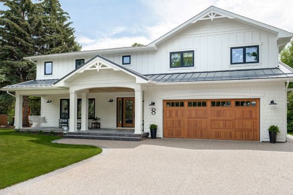 a house with a large white house. features garage door services garage door repair garage door installation provided by Retrak Door Service.