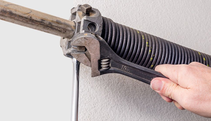 This scene from Lakewood, CO shows a person holding a pair of scissors. with features such as garage door services garage door repair garage door installation.