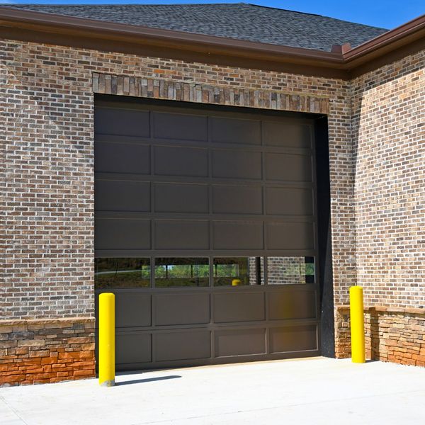 a brick wall with a fire hydrant on it. features garage door services garage door repair garage door installation garage door spring repair provided by Retrak Door Service.