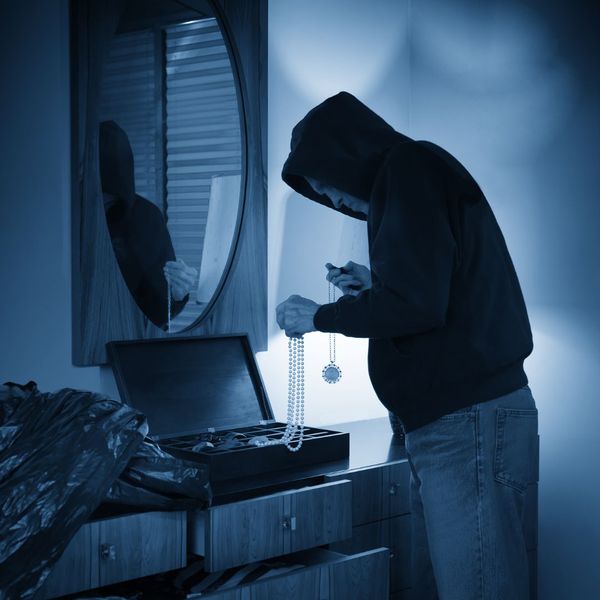 This scene from Lakewood, CO shows a man standing in front of a stove looking at something. with features such as garage door services garage door repair garage door installation garage door spring repair new garage doors.