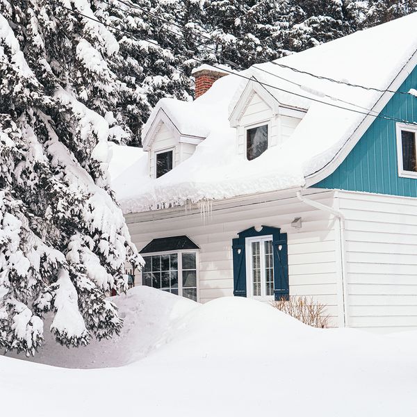 a man is standing on a snow covered slope. features garage door services garage door repair garage door installation garage door spring repair provided by Retrak Door Service.