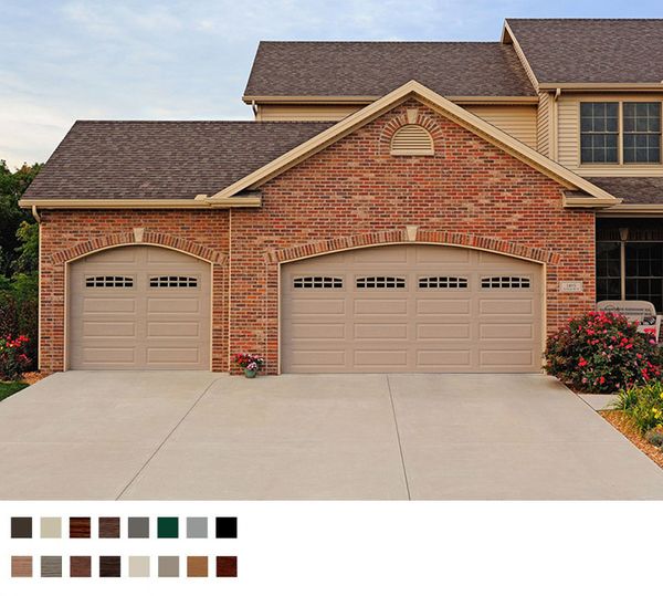 a house with a large brick building. features garage door services garage door repair garage door installation provided by Retrak Door Service.