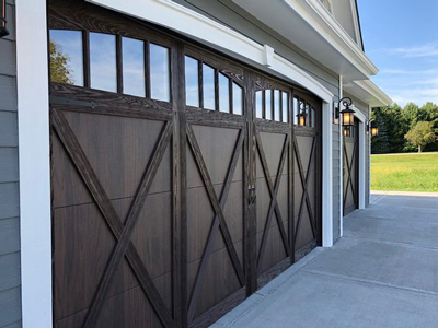 a wooden door leading to a large wooden door. features garage door services garage door repair garage door installation garage door spring repair provided by Retrak Door Service.