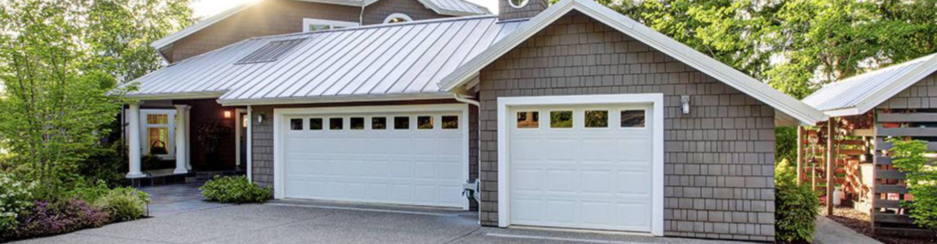 A white door leading to a house with a white door. showcasing features like garage door services garage door repair garage door installation garage door spring repair new garage doors.