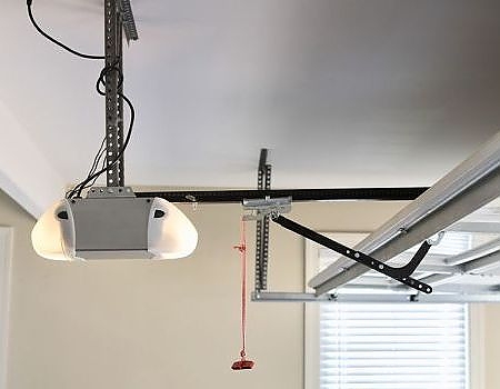 This scene from Lakewood, CO shows a kitchen with a ceiling fan and a hanging ceiling. with features such as garage door services garage door repair garage door installation garage door spring repair.